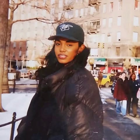 May be an image of hat, beret, parka and text