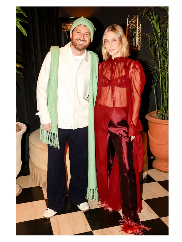 May be an image of one or more people, headscarf and text