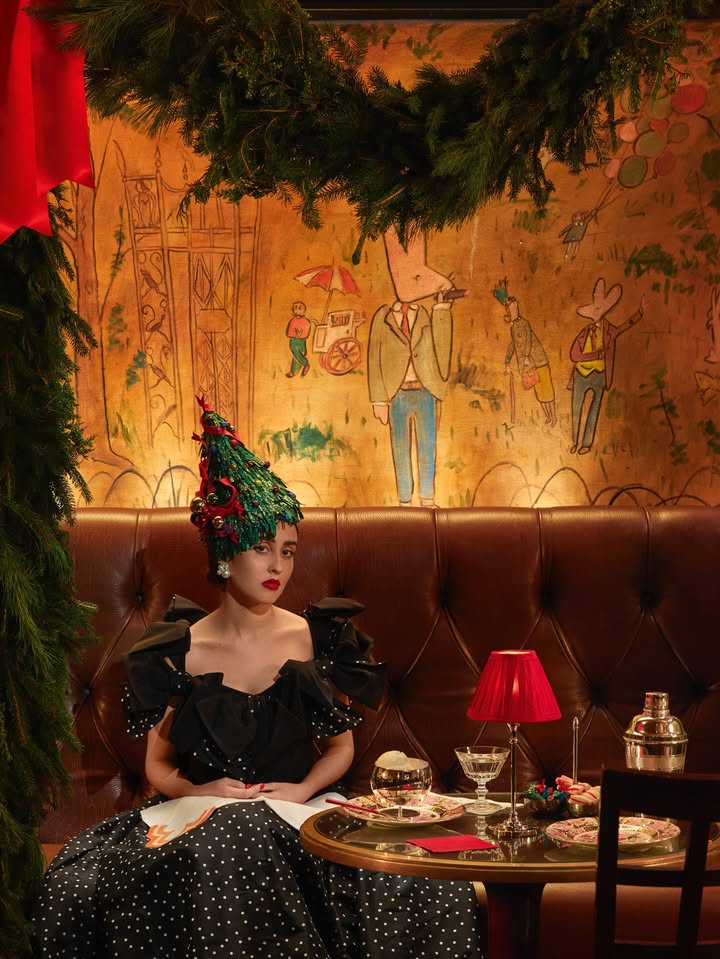 May be an image of tinsel, headdress and text