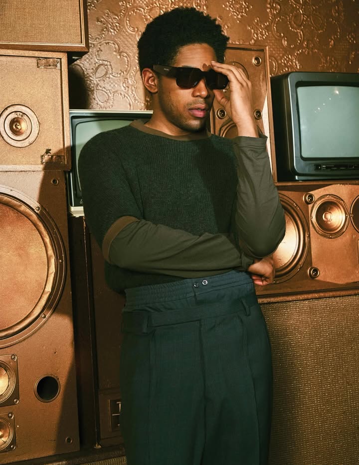 May be an image of one or more people, eyewear, turtleneck, portable cassette player and text