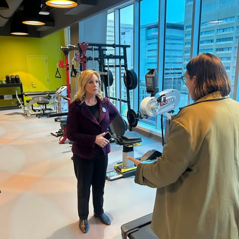 May be an image of standing, television, screen, treadmill, newsroom, hospital, office and text