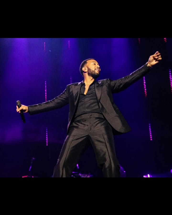 May be an image of blazer, microphone and concert