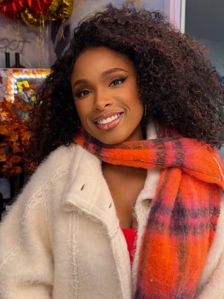 May be an image of one or more people, makeup, eyeliner, scarf, fur and text