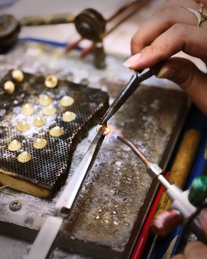 May be an image of jewelry and text