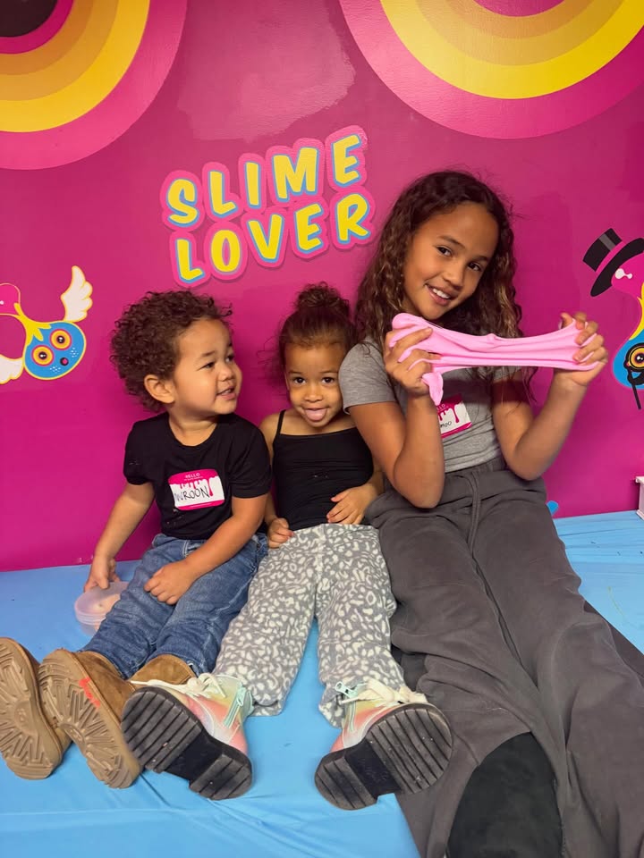 May be an image of baby, smiling, lollipop and text