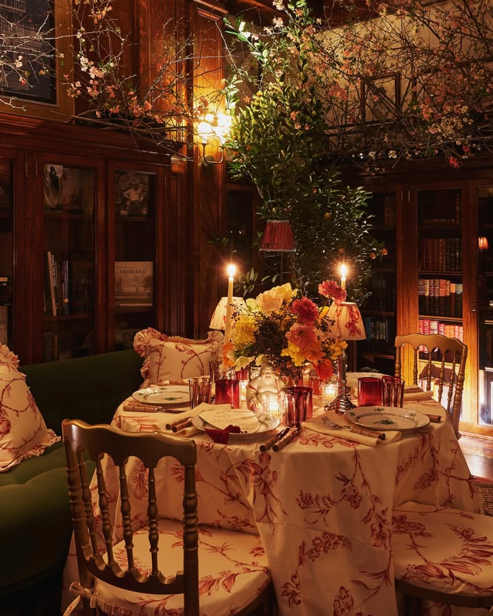 May be an image of candle holder, dining table, tablecloth and text