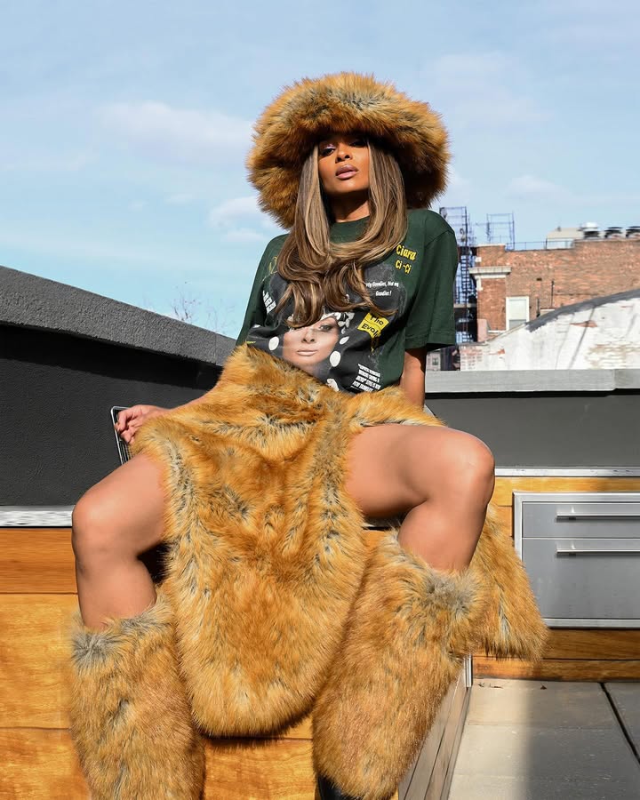 May be an image of one or more people, makeup, fur, headdress and text