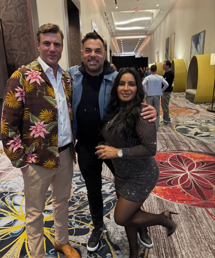 May be an image of standing, blazer and text