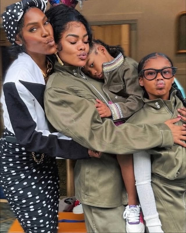 May be an image of child, makeup, people kissing, parka, sweatsuit and text