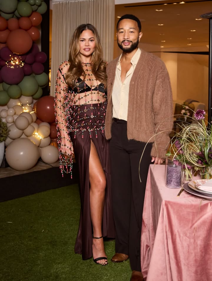 May be an image of one or more people, makeup, suit, dress, carpet and text