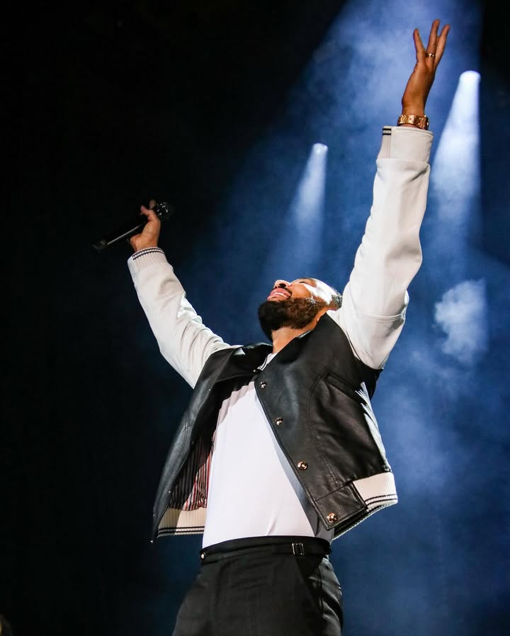 May be an image of microphone and concert