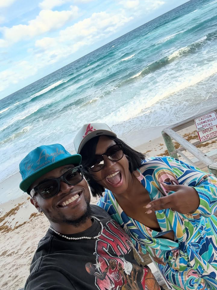 May be an image of smiling, ocean, beach, coast and text