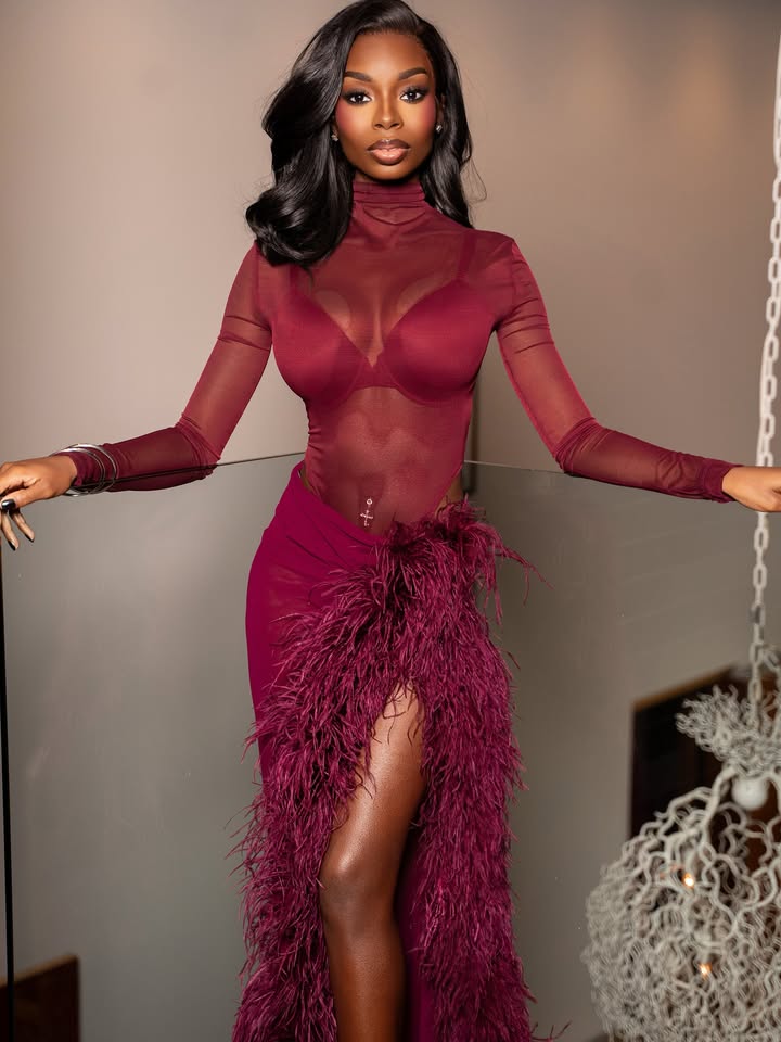 May be an image of one or more people, makeup, gown, dress, halter top and text