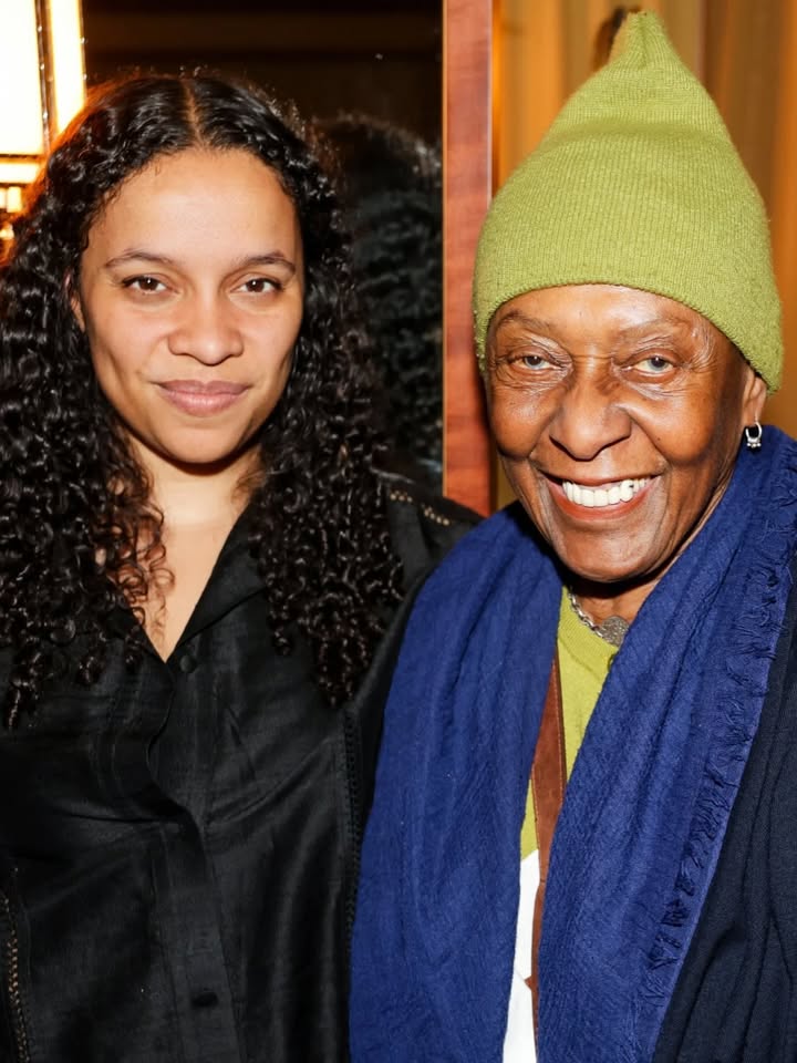 May be an image of one or more people, people standing, headscarf and text