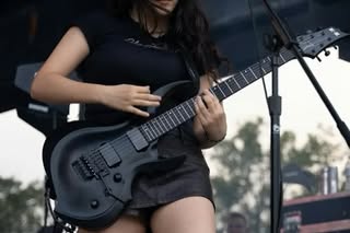 May be an image of guitar and text