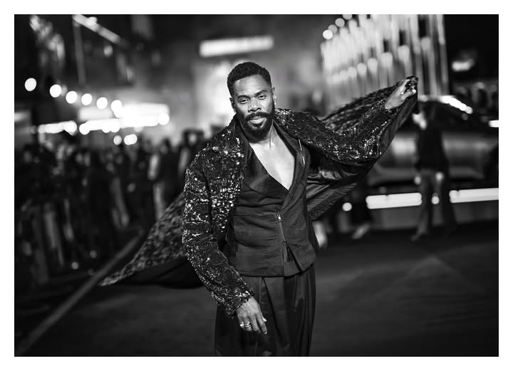 May be a black-and-white image of one or more people, beard, overcoat, suit, blazer, dinner jacket and text