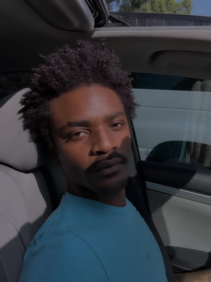 May be an image of one or more people and car