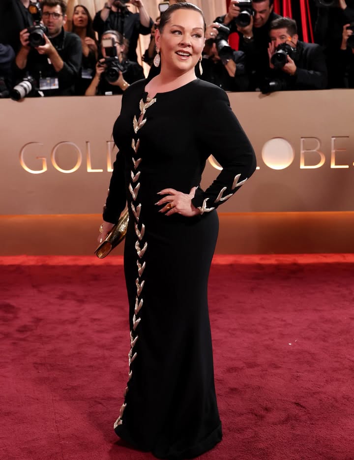 May be an image of gown, dress, carpet and text that says 'GOLI BE'