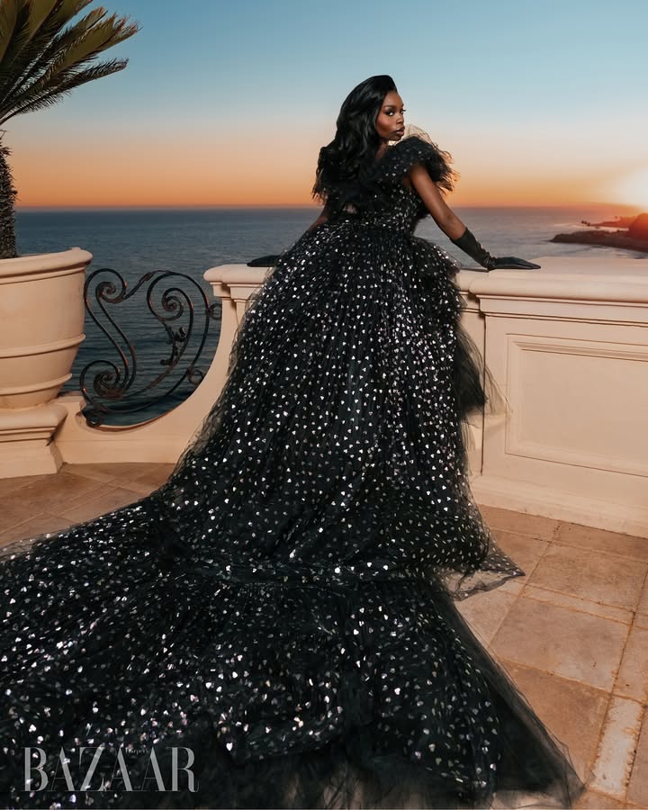 May be an image of gown, dress and text