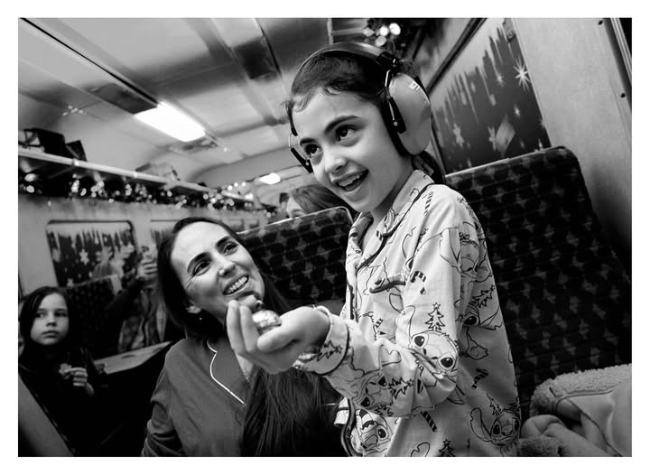 May be a black-and-white image of child, train, bus, portable cassette player and text