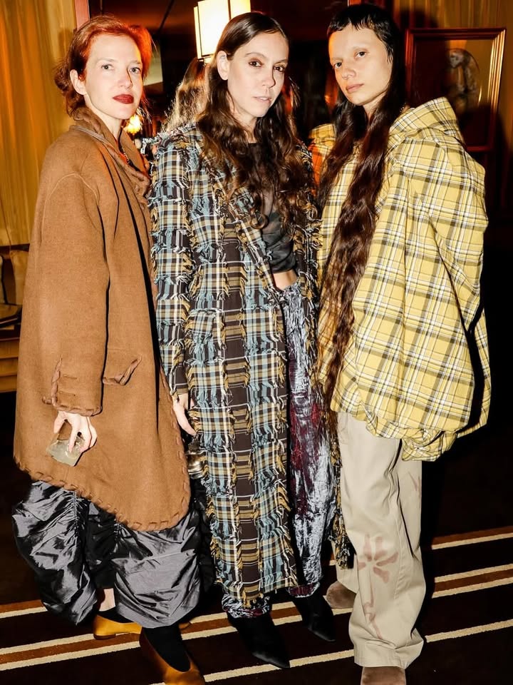 May be an image of fur coat, overcoat, duffle coat, kilt and text