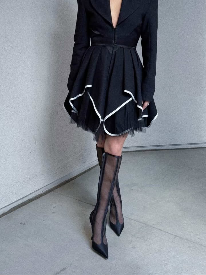 May be an image of dress and text