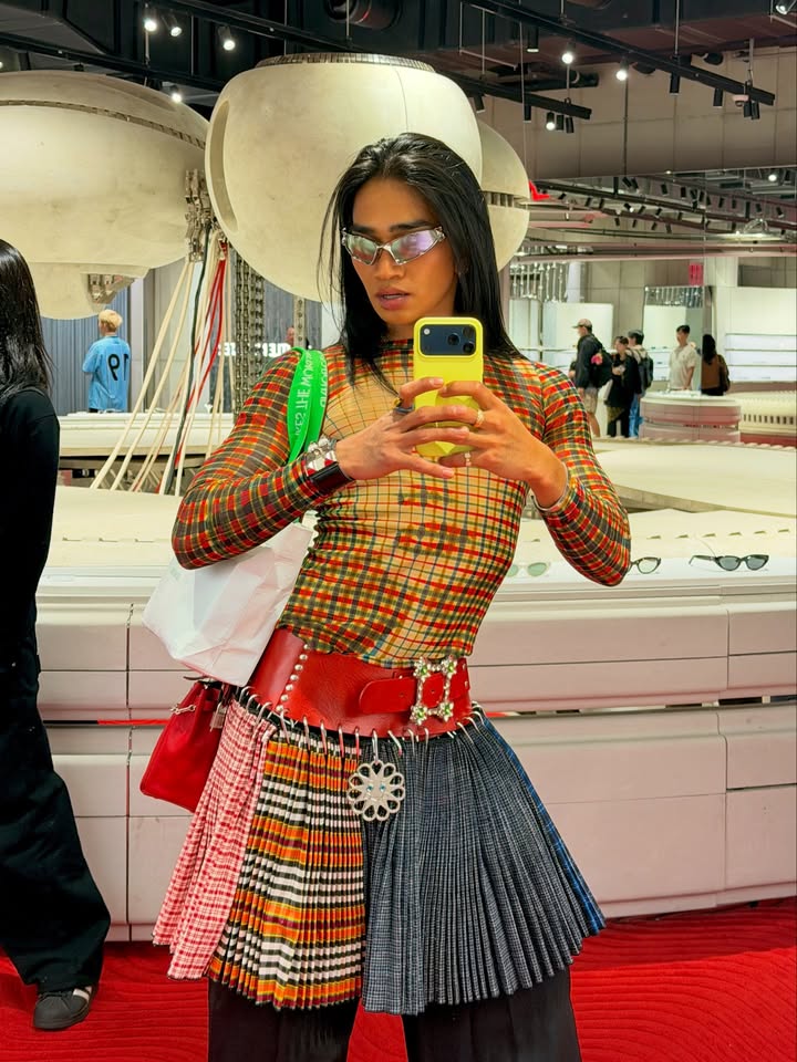 May be an image of kilt, mannequin, turtleneck and glasses