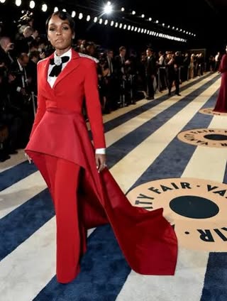 May be an image of suit, dress, gown, dinner jacket and text