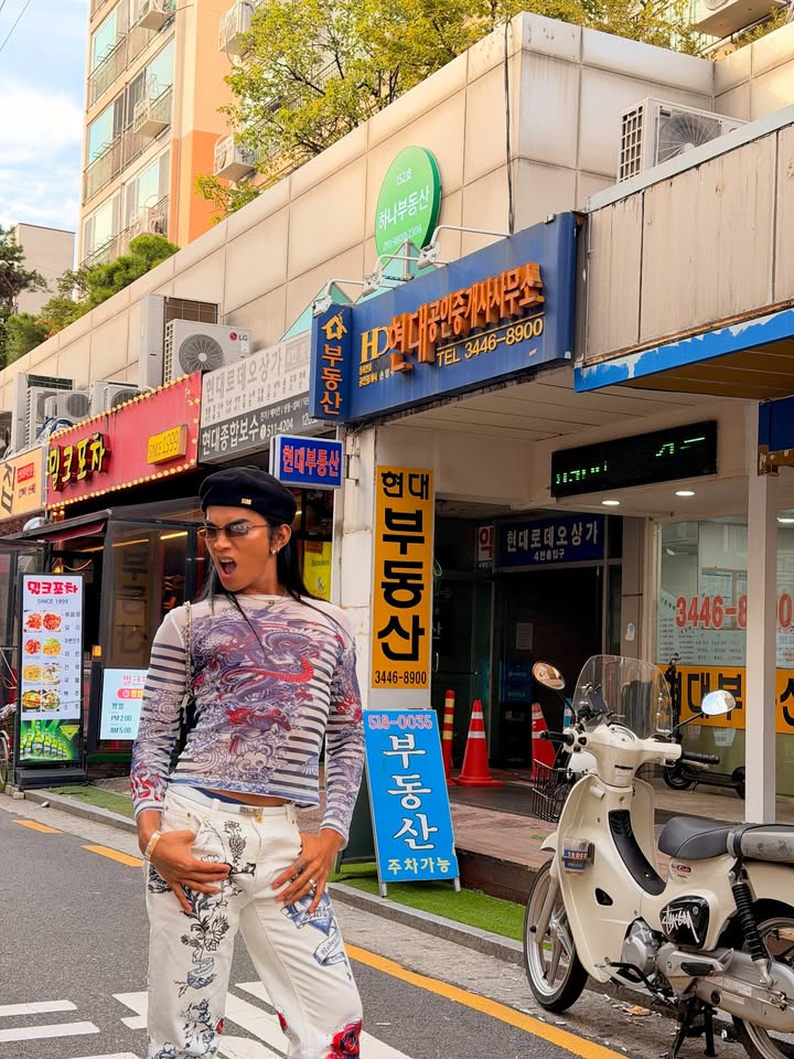 May be an image of one or more people and street