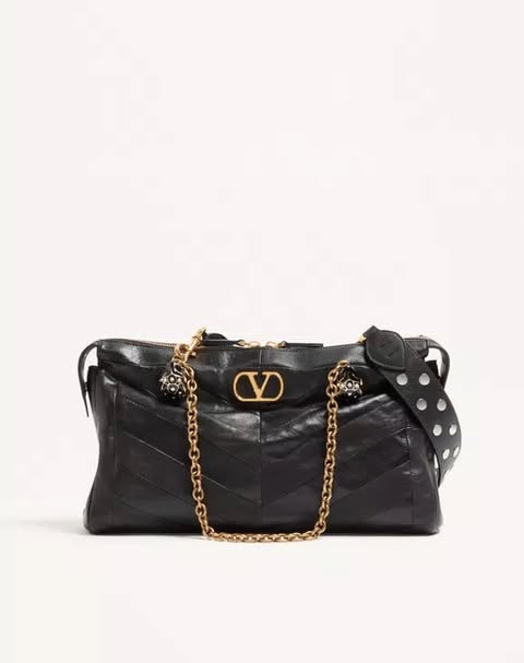 May be an image of purse and text that says 'CVD'