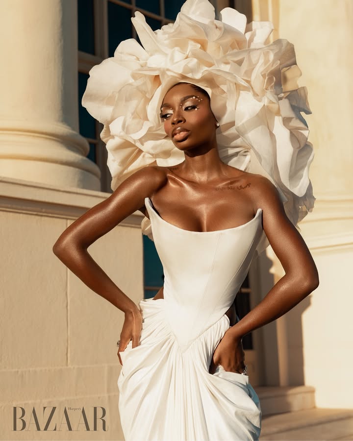 May be an image of one or more people, makeup, headdress, gown, dress and text