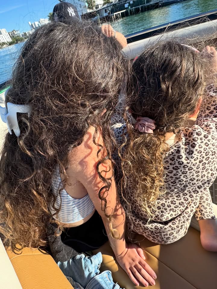 May be an image of baby, long hair and text