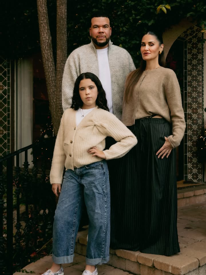 May be an image of one or more people, makeup, people standing, sweater, cardigan, turtleneck and text