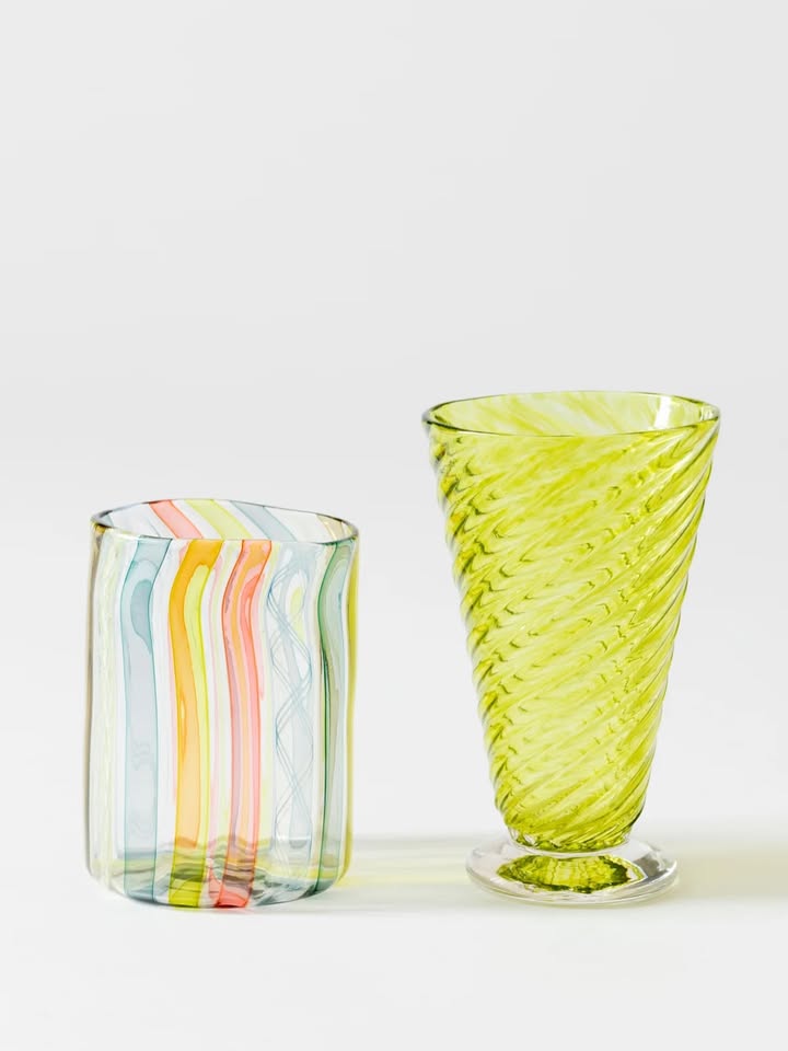 May be an image of vase, carafe, goblet and text