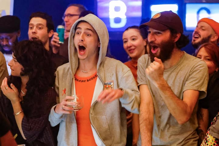 May be an image of one or more people, crowd and text