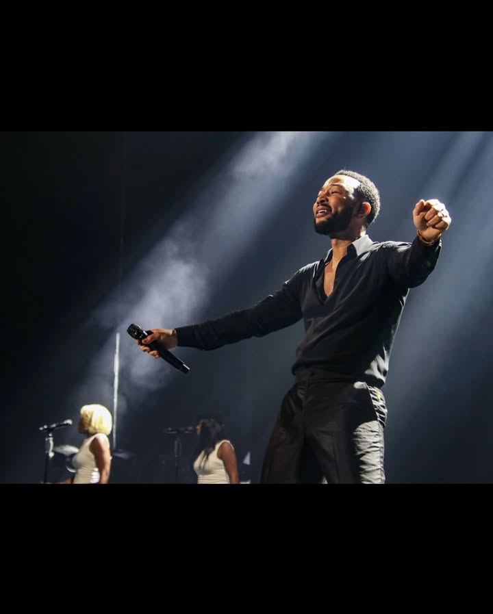 May be an image of microphone and concert