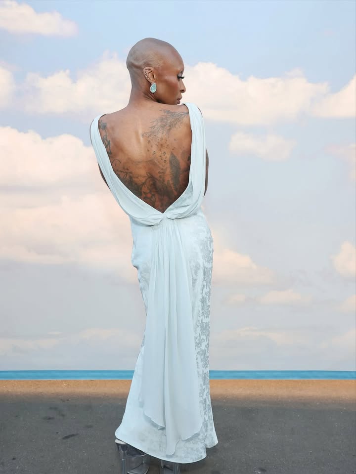 May be an image of one or more people, gown and dress