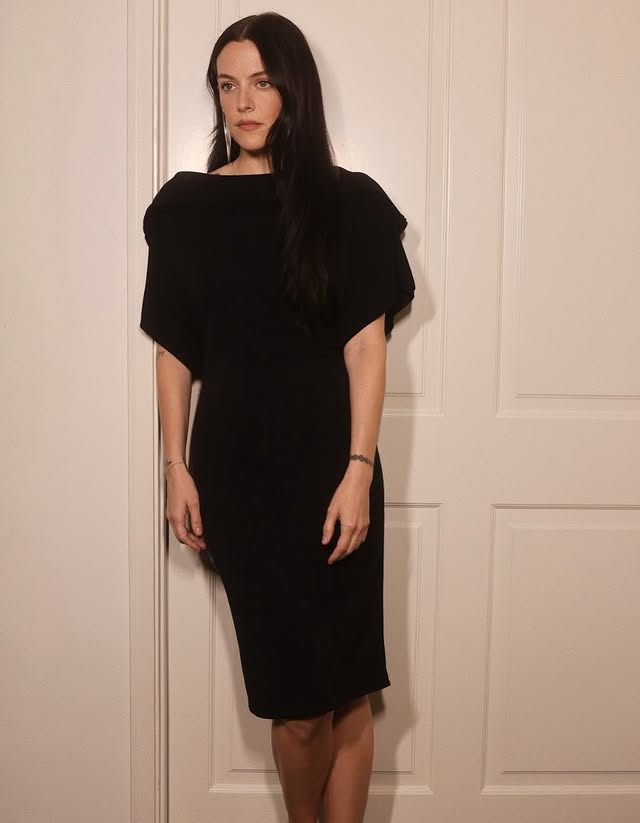 May be an image of one or more people, dress and text