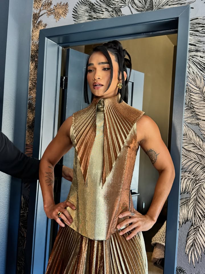 May be an image of one or more people, makeup, dress and text