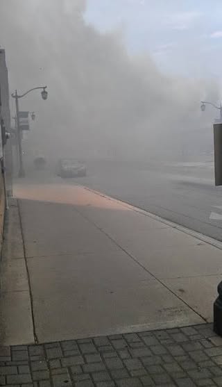 May be an image of fog, road and text