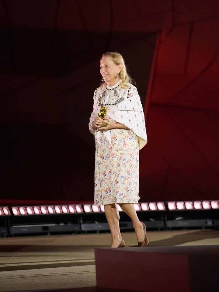 May be an image of one or more people, microphone and text