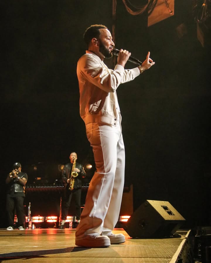 May be an image of microphone, concert and text