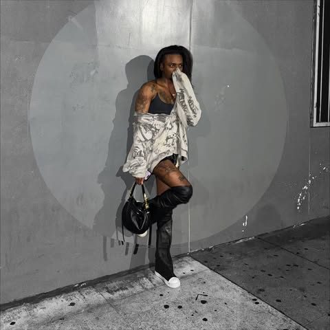 May be an image of one or more people, makeup and miniskirt