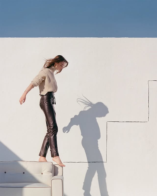 May be an image of leather and pants