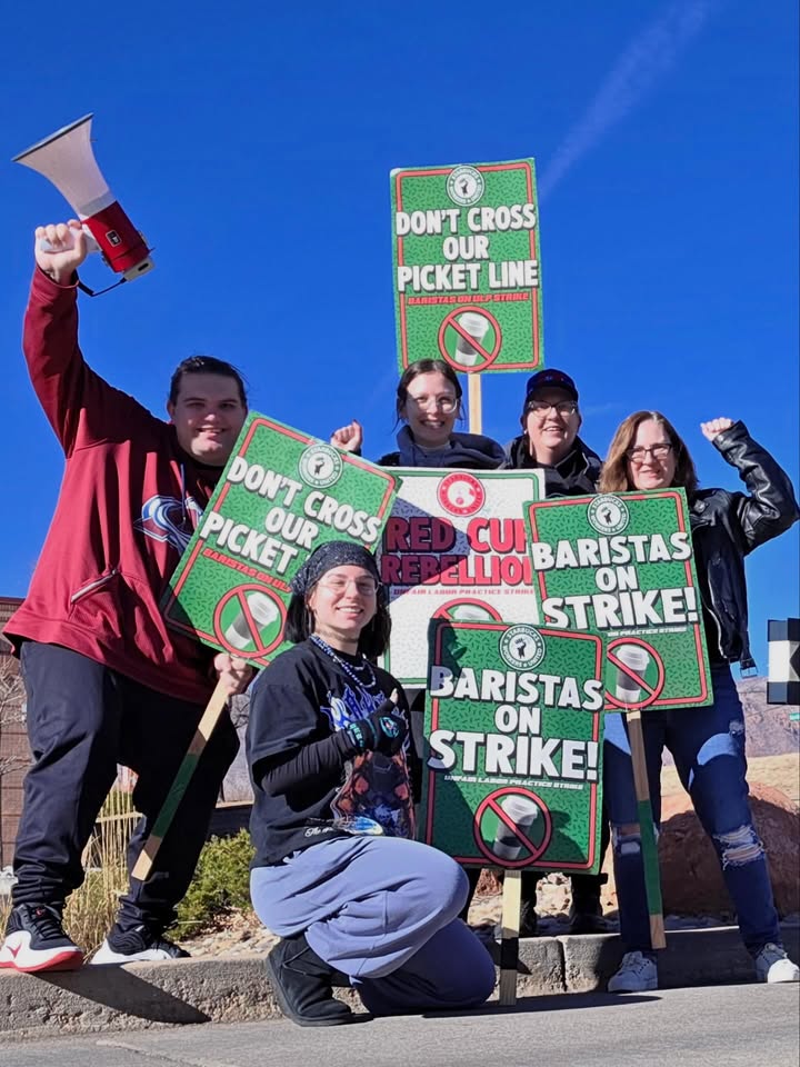 May be an image of standing, banner, poster and text