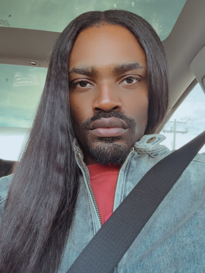 May be a selfie of one or more people, beard, long hair, turtleneck, seatbelt and text