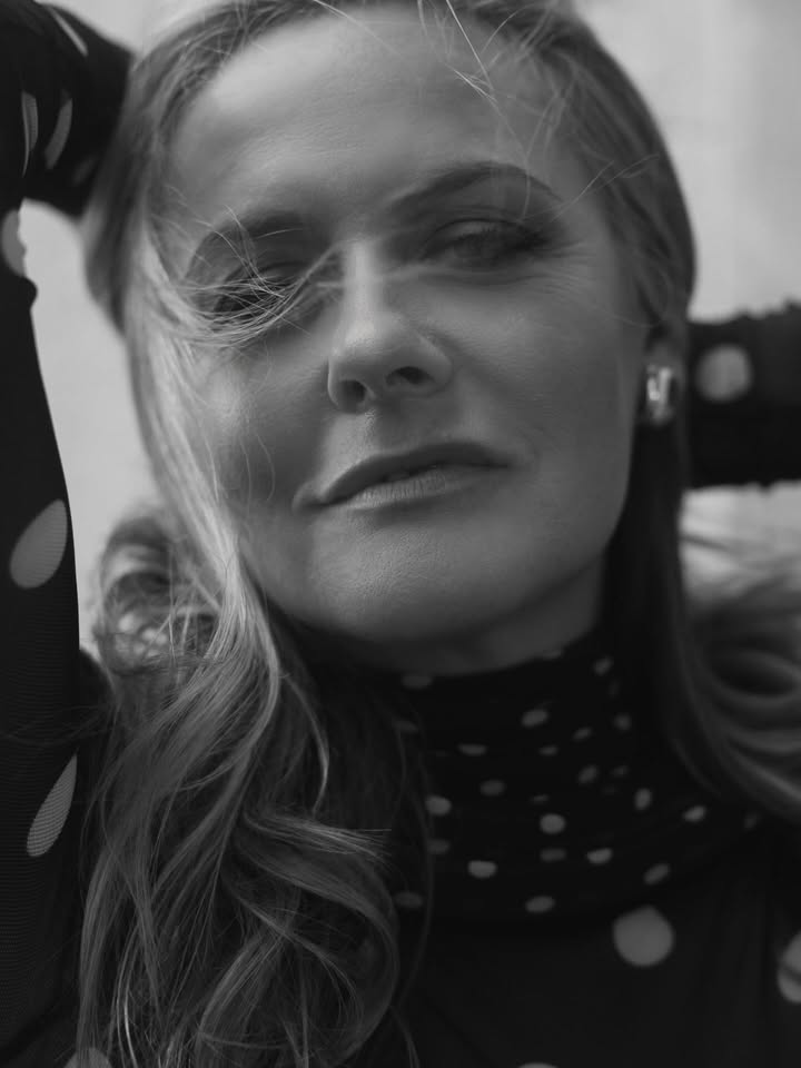 May be a black-and-white image of one or more people, makeup, turtleneck and text