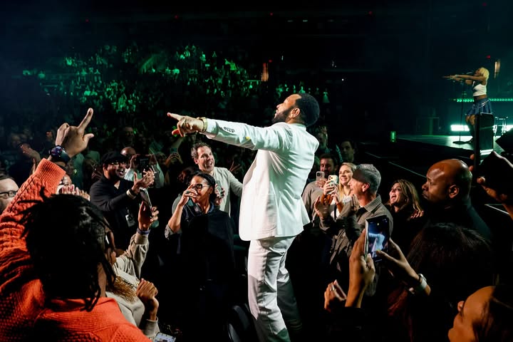 May be an image of saxophone, crowd, concert and text