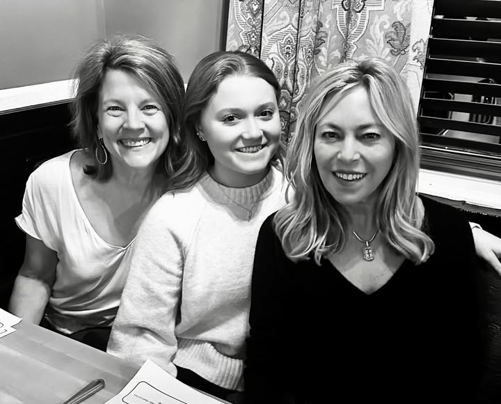 May be a black-and-white image of one or more people and text