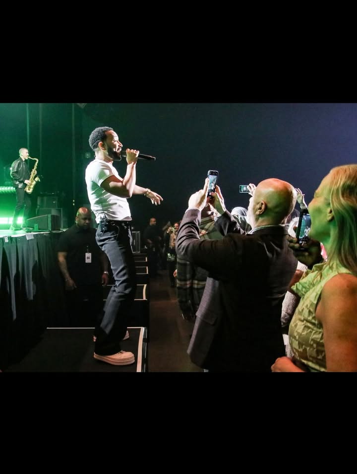 May be an image of saxophone, microphone, concert and text